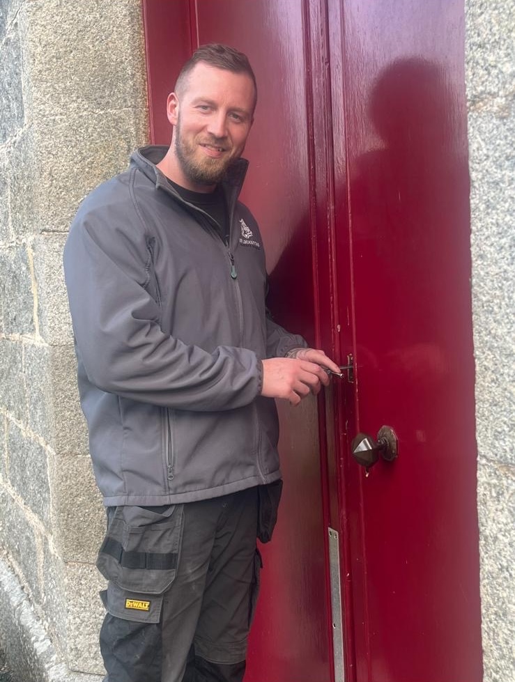 Darren from W.R Locksmiths carrying out locksmith repairs